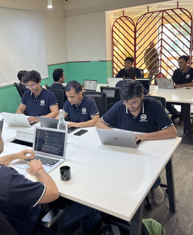 Newron engineers at work at their desks
