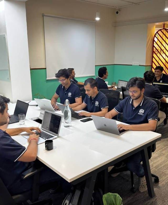 The Newron team working in the office